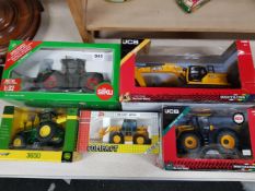 5 BOXED MODEL TRACTORS AND JCB'S