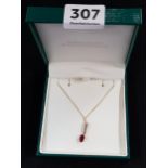 9 CARAT GOLD RUBY AND DIAMOND DROP ON GOLD CHAIN