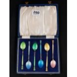 ANTIQUE SILVER AND ENAMEL HARLEQUIN SET OF COFFEE SPOONS