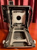 GRAFLEX Speed Graphic 3.25 x 4.25 inch No lens plate or lens. Includes metal hood. Glass plate