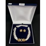 DESIGNER SET OF PEARLS WITH HEAVY 18 CARAT GOLD DOUBLE LEOPARD HEAD ADORNED WITH RUBY EYES AND