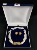 DESIGNER SET OF PEARLS WITH HEAVY 18 CARAT GOLD DOUBLE LEOPARD HEAD ADORNED WITH RUBY EYES AND
