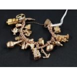 9 CARAT GOLD CHARM BRACELET CIRCA 59.9 GRAMS