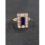 18 CARAT GOLD SAPPHIRE AND DIAMOND RECTANGULAR RING - 2 CARRE CUT SAPPHIRES IN CENTRE OF HEAD SET IN