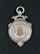 ROSE GOLD AND SILVER IRISH FOOTBALL MEDAL - MID ULSTER FOOTBALL ASSOCIATION - DATED 1908 AND AWARDED