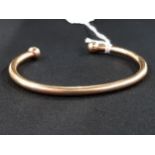 9 CARAT GOLD TORQUE BANGLE CIRCA 8.4G