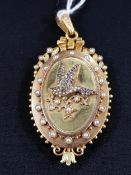 18 CARAT GOLD LOCKET. BIRD TO FRONT SET WITH DIAMONDS, RUBY, PERIDOT & SAPPHIRE SURROUNDED BY SEED
