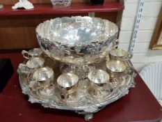 SILVER PLATED PUNCH BOWL ON LARGE ORNATE SILVER PLATED TRAY WITH PUNCH CUPS