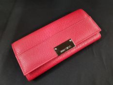 JIMMY CHOO RED LEATHER LADIES PURSE IN ORIGINAL BOX TOGETHER WITH DUST COVER. NEVER USED & PURCHASED