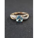 9 CARAT GOLD DIAMOND AND BLUE TOPAZ RING