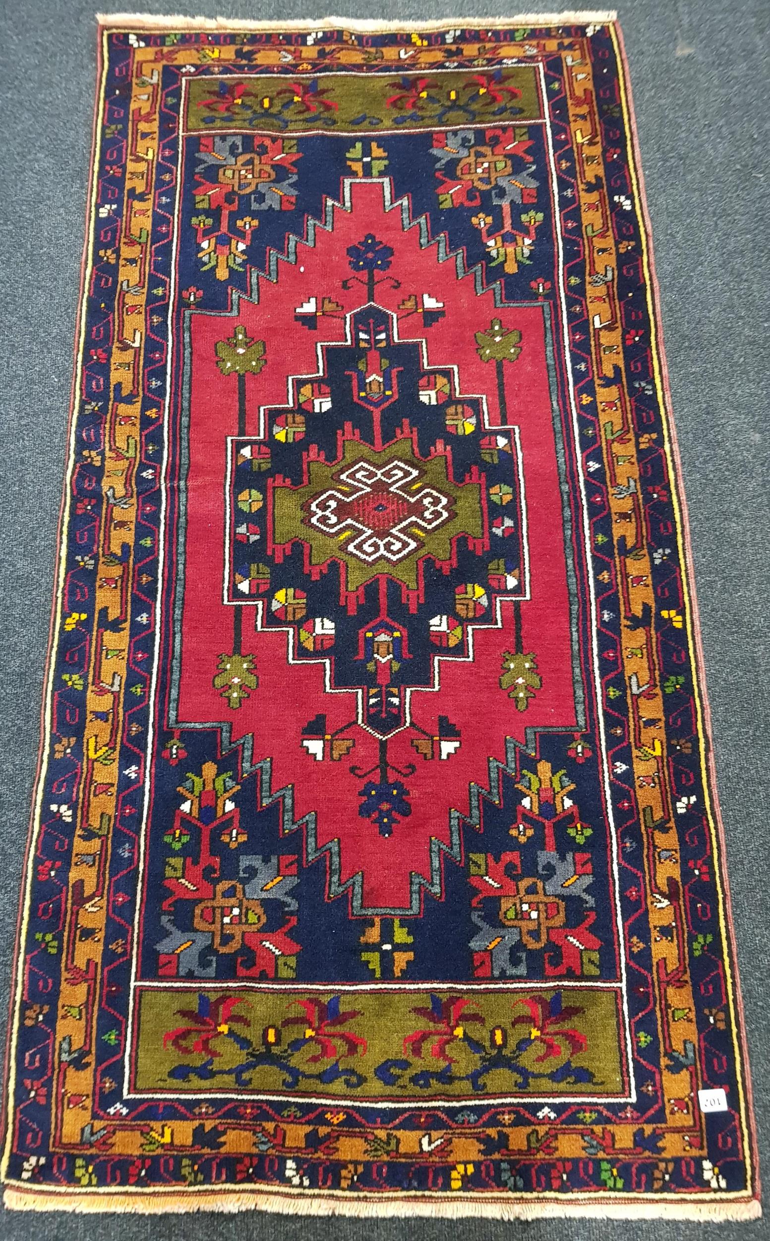 SMALL RED WOOLEN RUG