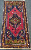 SMALL RED WOOLEN RUG