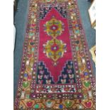 LARGE RED WOOLEN RUG