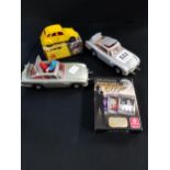 3 VINTAGE JAMES BOND MODEL CARS AND PLAYING CARDS