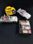 3 VINTAGE JAMES BOND MODEL CARS AND PLAYING CARDS