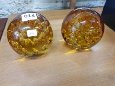 PAIR OF COLOURED GLASS PAPERWEIGHTS