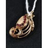 9 CARAT GOLD ( TESTED) BIRD ON BRANCH BROOCH. SET IN RED STONES.