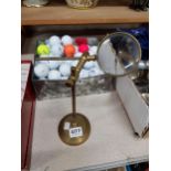 BRASS MAGNIFYING GLASS ON STAND