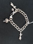 SILVER BRACELET WITH SILVER HAWARIAN THEMED CHARMS