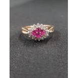 9 CARAT GOLD RUBY AND DIAMOND CLUSTER RING