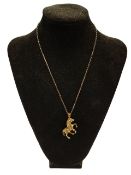 9 CARAT GOLD QRTICULATED HORSE ON 9 CARAT GOLD CHAIN 11.2 GRAMS