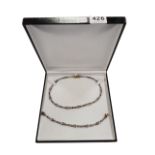 MATCHING 9 CARAT YELLOW & WHITE GOLD NECKLACE AND BRACELET CIRCA 30.5 GRAMS