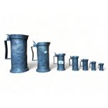 SET OF 7 GRADUATED ANTIQUE PEWTER MEASURE JUGS