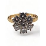 18 CARAT YELLOW GOLD AND DIAMOND 7 STONE DIAMOND RING WITH CIRCA 1.25 CARAT OF DIAMONDS