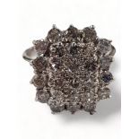 18 CARAT WHITE GOLD CLUSTER RING CIRCA 1 CARAT OF DIAMONDS