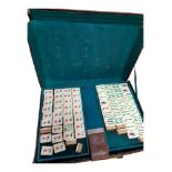 ANTIQUE ORIENTAL MAHJONG SET IN LEATHER CASE