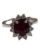 18 CARAT WHITE GOLD, RUBY & DIAMOND RING WITH 0.25 CARAT OF DIAMONDS SIZE L AND A HALF