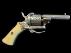 A Belgian Six-Shot 0.22” 7mm pin fire miniature revolver. Engraved cylinder and frame with scrolls