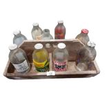 WOODEN CRATE WITH 9 VINTAGE MILK BOTTLES