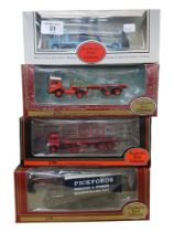 4 BOXED MODEL CARS