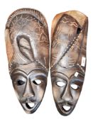 PAIR OF LARGE WOOD CARVED FACE MASKS