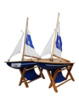 PAIR OF SMALL POND YACHTS ON STANDS