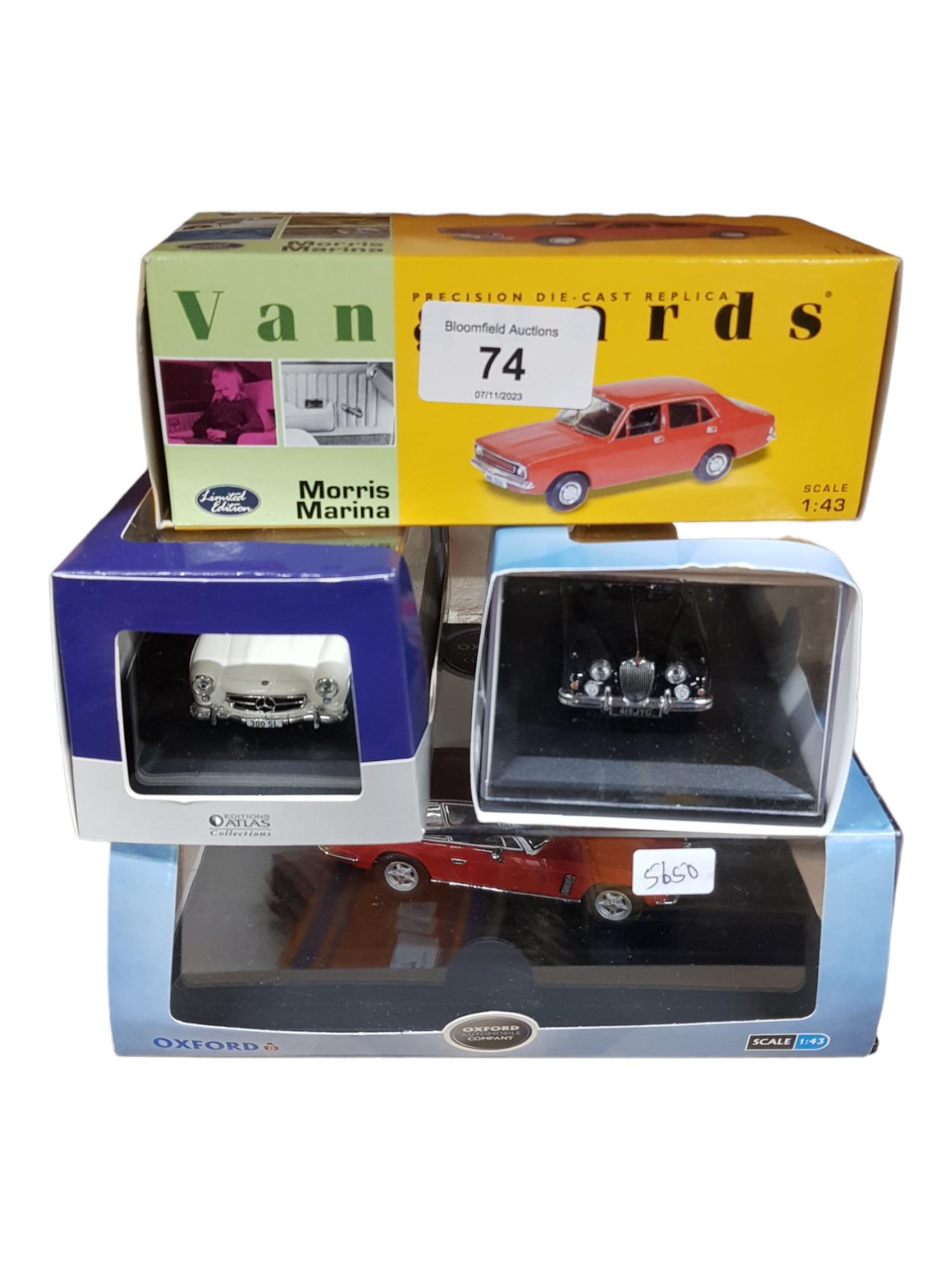 4 BOXED MODEL CARS