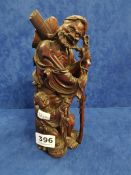 ANTIQUE CARVED ORIENTAL FIGURE AND STAND