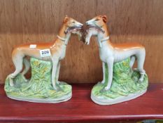 PAIR OF ANTIQUE STAFFORDSHIRE GREYHOUNDS - GOOD CONDITION