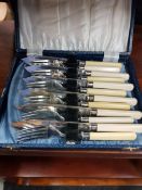 SILVER COLLARED FISH KNIVES AND FORKS