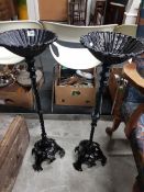 A PAIR OF CAST IRON STANDS