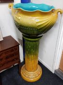 A VERY LARGE VICTORIAN MAJOLICA PLANTER ON STAND. WILLIAM AULT. DESIGNED BY CHRISTOPHER DRESSER
