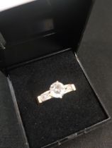 10K SOLITAIRE RING WITH WHITE SAPPHIRE SHOULDERS