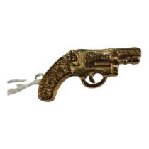 YELLOW METAL REVOLVER CHARM