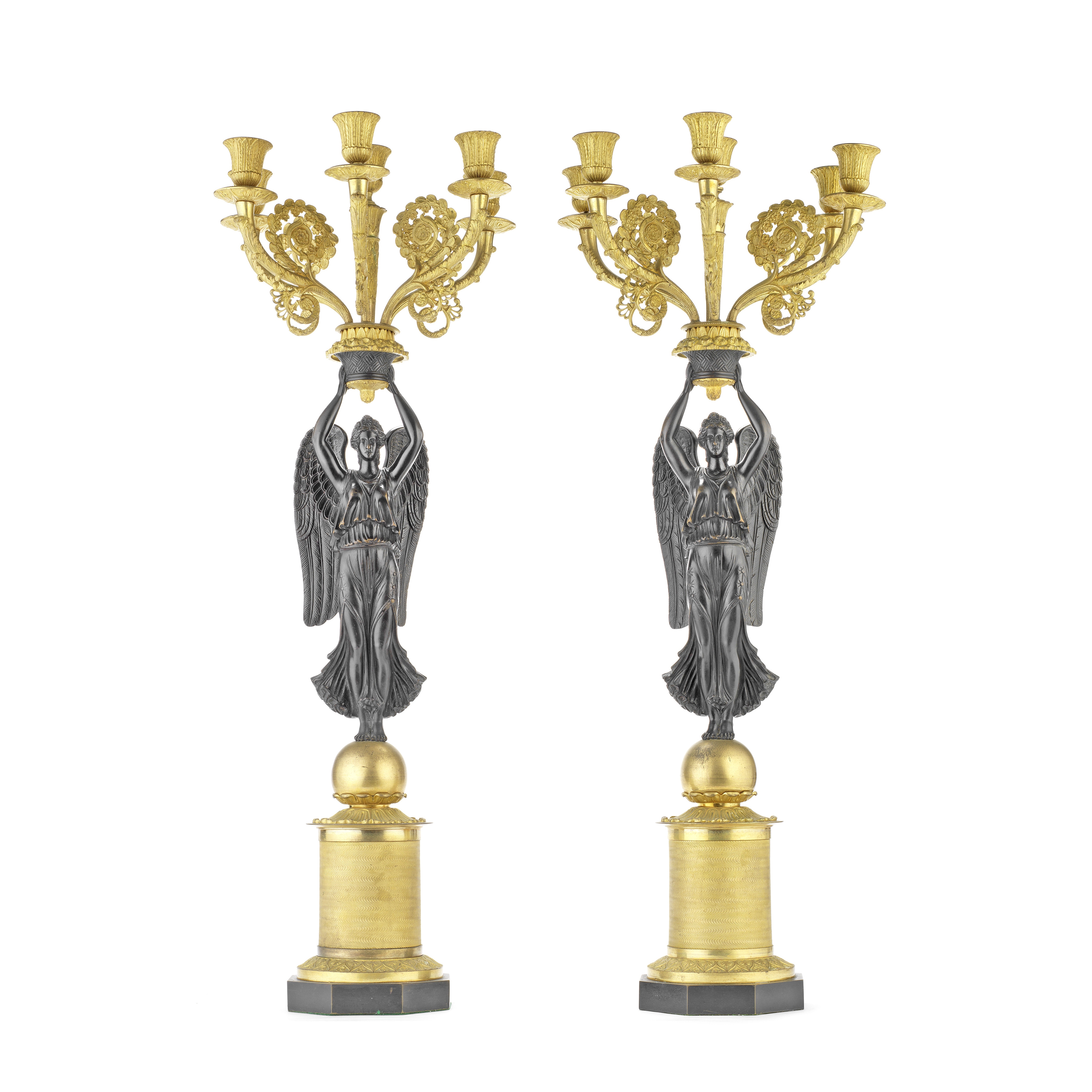 A PAIR OF 19TH CENTURY FRENCH GILT AND PATINATED BRONZE FIGURAL SIX-LIGHT CANDELABRA IN THE EMPI...