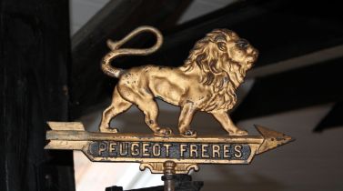 A Peugeot Freres cast metal sign, (3)