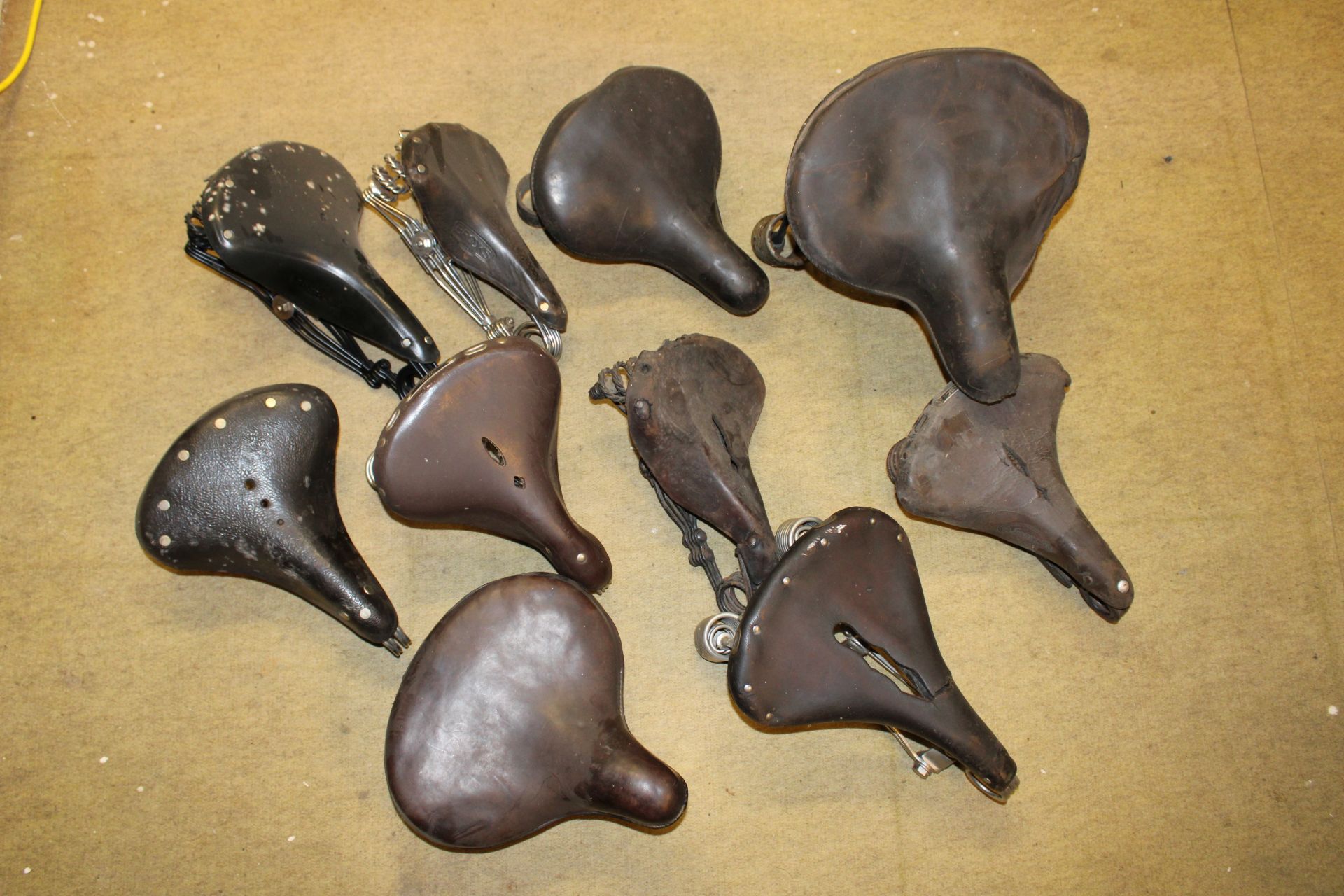 Ten bicycle/motorcycle saddles, (Qty)