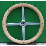 A wood rimmed steering wheel,