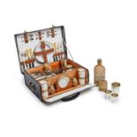 A Mappin & Webb picnic set, London, circa 1910 H:10,7 48 x 36 cm 51 x 35 x 19cm