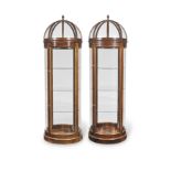 A pair of mahogany domed and cylindrical shop display cabinets (2)